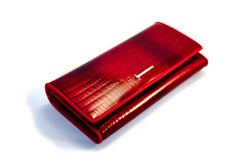 Red female wallet on a white background