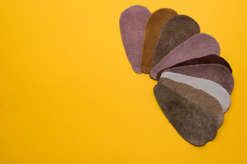 Copies of different types of skin on a yellow background
