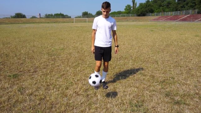 teenager playing soccer ball