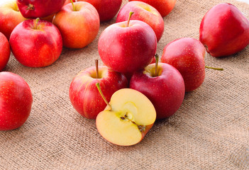 red apples on sackcloth fabric