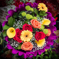 Elegant roses and daisies in a bride flower bouquet