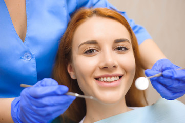 Fototapeta premium Dentist examining a patient's teeth in the dentist.