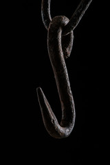 Obraz premium close up view of vintage rusty hook isolated on black