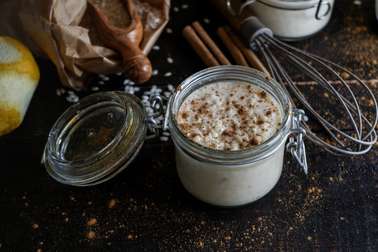 Glass jars with served rice and milk