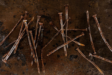 flat lay with vintage nails arranged on sharped rusty surface