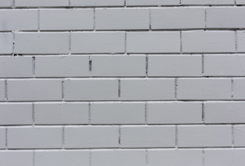 White painted horizontal stone bricks wall pattern texture background close-up shot