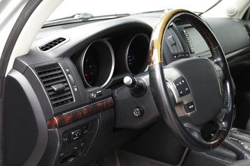 Fototapeta na wymiar Old Steering wheel on the car dashboard