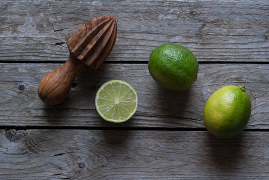 Delicious limes with manual citrus juicer