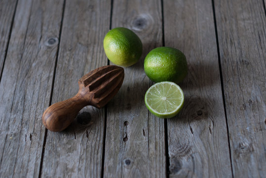 Delicious limes with manual citrus juicer