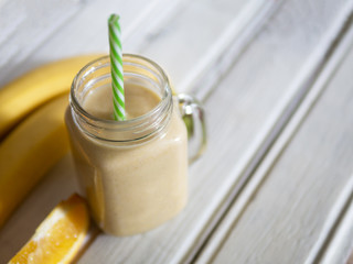 fresh fruit yellow cocktail smoothie from banana and orange
