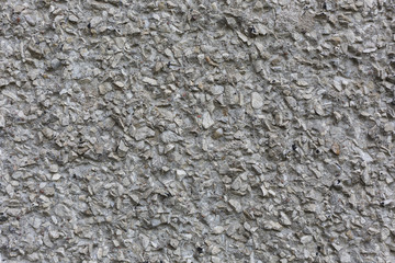 rough concrete surface with stones seamless abstract pattern texture background