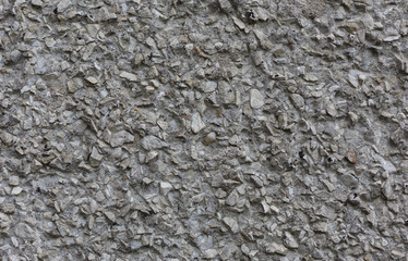 rough unpolished concrete surface with stones abstract pattern texture background horizontal