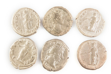 Roman denarius lie on a white background, the era of the Antonines, Marcus Aurelius, Antoninus Pius, Commodus, Caesar