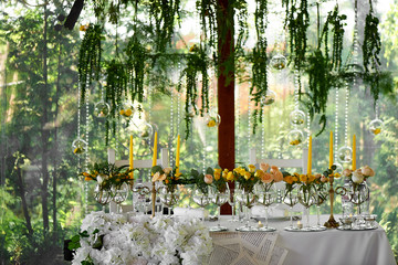 Wedding table decoration. Wedding flowers in yellow