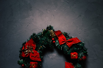 Christmas wreath on a dark textured background