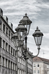 Fototapeta na wymiar Vintage lantern in the street. Details. Nuremberg, Bavaria, Germany. Black and white photo