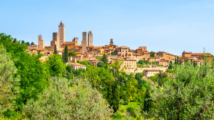 Fototapeta na wymiar San Gimignano - medieval town with many stone towers, Tuscany, Italy. Panoramic view of cityscape.