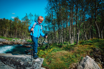 little boy hiking travel in mountains