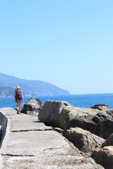 Woman walking on Pier Near Sea