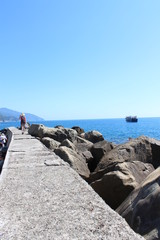 Woman walking on Pier Near Sea