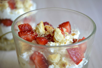 Trifle or dessert with cottage cheese and strawberries. Breakfast
