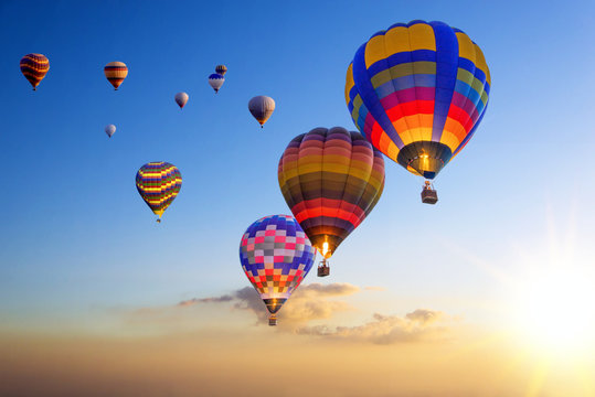 Hot air balloons on the air with sunset sky