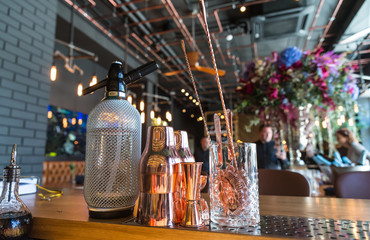 Classic bar counter with bottles in blurred background