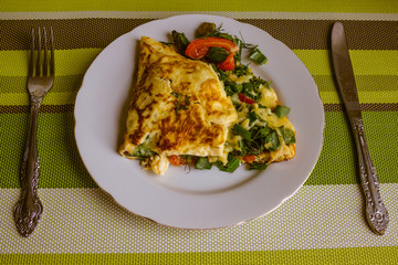 Plate with an omelette.