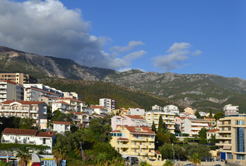 Coastal city at the foot of the mountain. Becici, Montenegro, View of the city and mountains