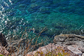 Nice view of the sea. Calm clean sea. Large stones. View from above. The Adriatic. Montenegro