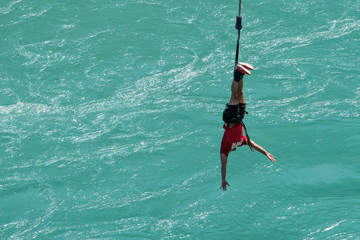 Sequence of a young lady bungy jumping at Kawarau bungy centre