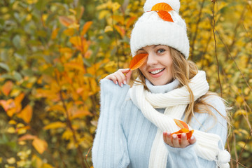 Young attractive woman in autumn colorful background