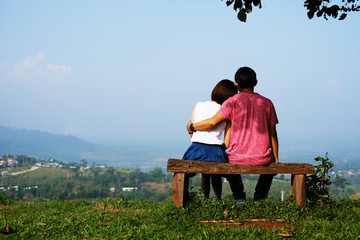 Naklejka na ściany i meble Romantic loving Asia couple sitting