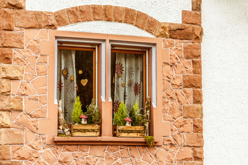 Window with decors and brick wall