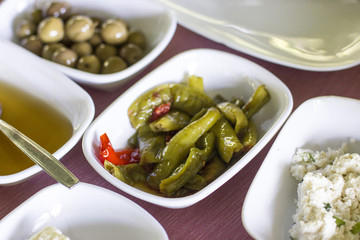 Turkish breakfast. Olives, baked peppers, honey, home-made cottage cheese