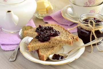 Wholegrain toast with blackcurrant jam and butter