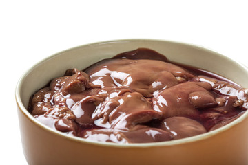 Bowl with chicken raw liver isolated over white background with clipping path