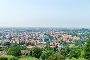 Fototapeta na wymiar Bergamo, Italy - May 30, 2018: Aerial panoramic cityscape view of Bergamo.