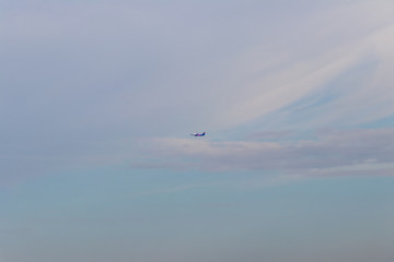 passenger airliner takes off to the blue sky background
