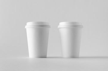 12 oz. white coffee paper cup mock-up with lid.