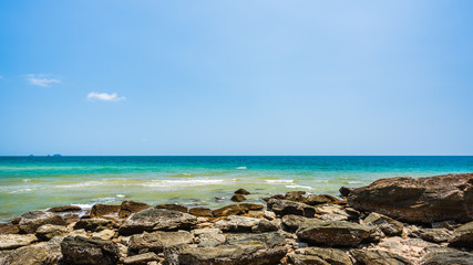 Fototapeta na wymiar Sea rocks on the beach in sunny day