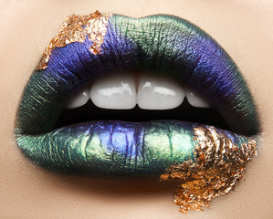 Fototapeta premium Macro and close-up creative make-up theme: beautiful female lips with pink lipstick, white diamonds and teeth, retouched photo