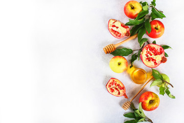 Rosh hashanah jewish New Year holiday concept. Traditional symbol. Apples, honey, pomegranate. Copy space. Top view. Flat lay.