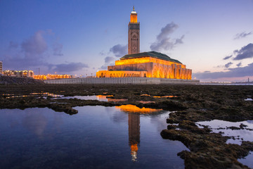 view of Hassan II mosque view of Hassan II mosque reflected on water - Casablanca - Morocco on...