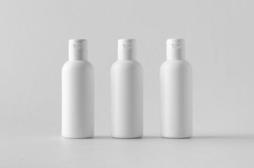 White plastic cosmetic lotion bottle mock-up with cap.