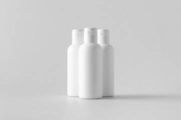 White plastic cosmetic lotion bottle mock-up with cap.