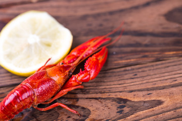 Boiled crawfish on wooden table