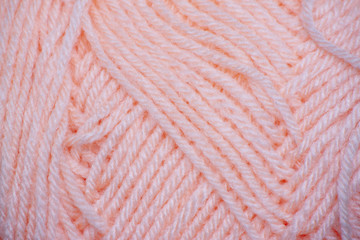 Top view ball of roll yarn pink color for background and texture.