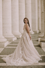 Fototapeta premium Pretty young bride in wedding dress in the Vatican