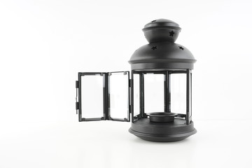 Black lantern over white background. Religion concept